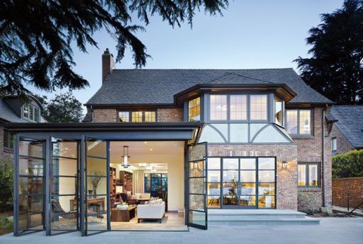 design renovation modernizes a classic tudor Exterior Black Window Panes